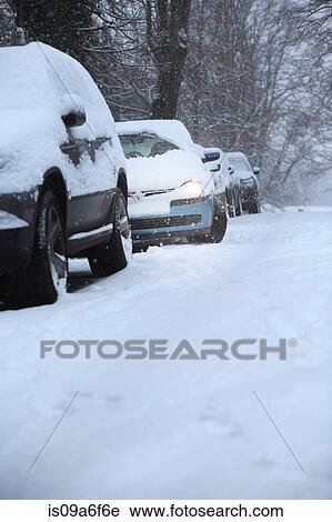 Car stuck in snow covered street View Large Photo Image Stock Image - Car stuck in snow covered street. Fotosearch
