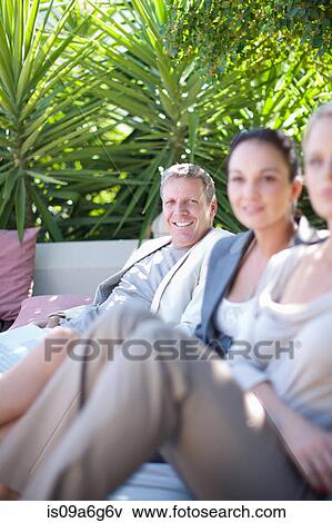 Casual business people on patio View Large Photo Image Stock Photo - Casual business people on patio. Fotosearch