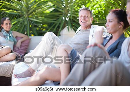 Casual business people on patio View Large Photo Image Stock Photograph - Casual business people on patio. Fotosearch