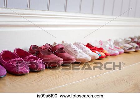 Stock Image - Child's shoes in a row. Fotosearch