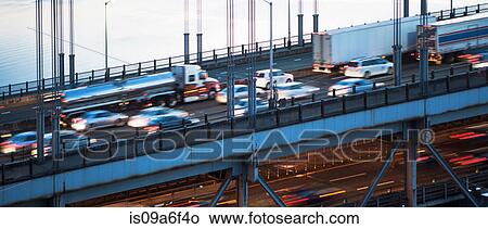 Picture - Close-up of busy traffic crossing bridge. Fotosearch