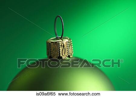 Stock Photography - Close up of green christmas bauble. Fotosearch