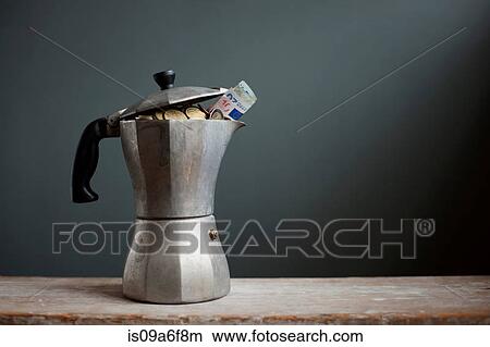 Coffee pot with Euros inside View Large Photo Image Picture - Coffee pot with Euros inside. Fotosearch