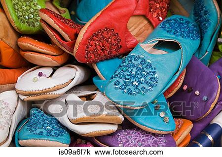 Stock Image - Colourful leather shoes for sale. Fotosearch