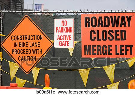 Construction signage on wire fence View Large Photo Image Stock Image - Construction signage on wire fence. Fotosearch