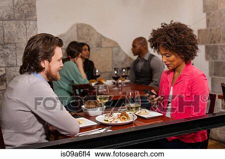 Picture - Couple at restaurant. Fotosearch