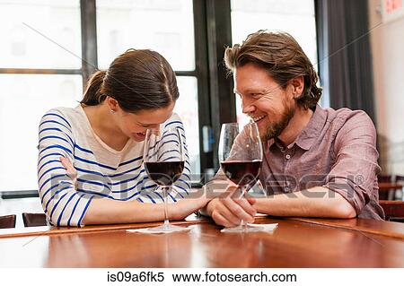 Couple at wine bar View Large Photo Image Stock Photography - Couple at wine bar. Fotosearch