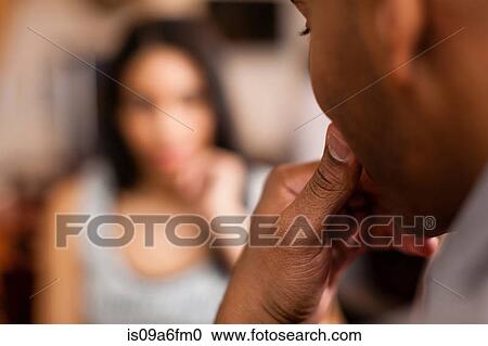 Stock Image - Couple having a conversation. Fotosearch