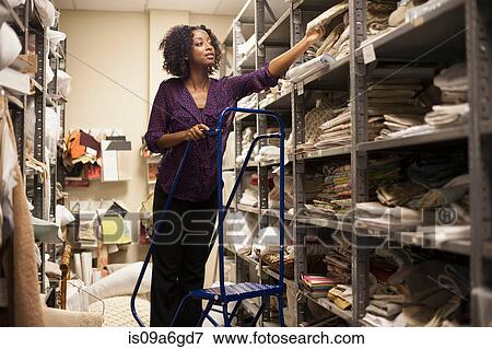 Designer in warehouse View Large Photo Image Stock Photo - Designer in warehouse. Fotosearch
