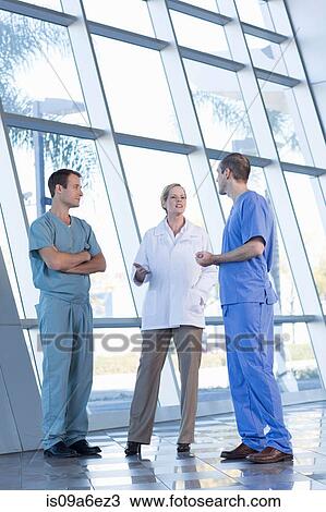 Stock Image - Doctors in discussion. Fotosearch