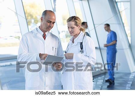 Stock Photography - Doctors in discussion. Fotosearch