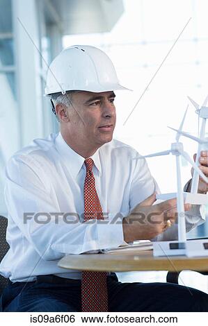 Engineer with model wind turbines View Large Photo Image Stock Photograph - Engineer with model wind turbines. Fotosearch