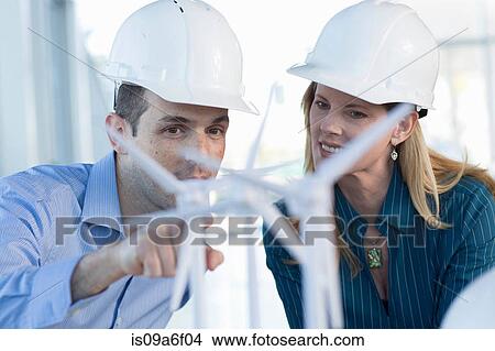 Picture - Engineers with model wind turbines. Fotosearch