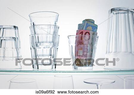 Euro banknotes in glass on shelf View Large Photo Image Stock Image - Euro banknotes in glass on shelf. Fotosearch