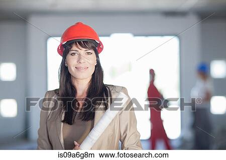 Female architect with blueprint View Large Photo Image Picture - Female architect with blueprint. Fotosearch