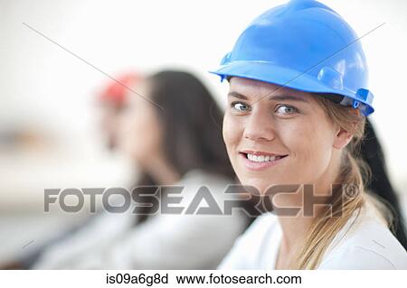 Female laborer smiling View Large Photo Image Stock Image - Female laborer smiling. Fotosearch
