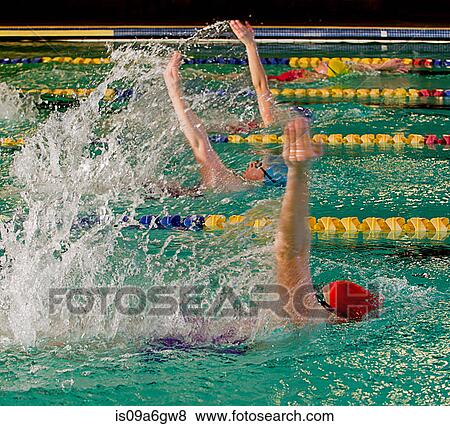 Female swimmers doing backstroke in swimming pool View Large Photo Image Stock Photo - Female swimmers doing backstroke in swimming pool. Fotosearch