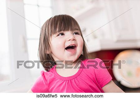 Stock Photography - Female toddler laughing. Fotosearch