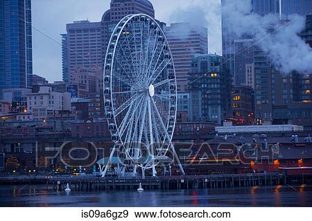 Stock Photo - Ferris wheel on dock, Seattle, USA. Fotosearch