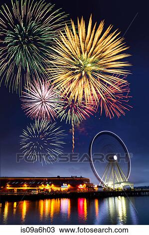 Stock Image - Fireworks and dock at Puget Sound, Seattle, USA. Fotosearch