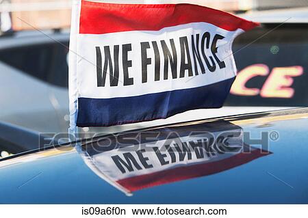 Picture - Flag saying We Finance at car dealership. Fotosearch
