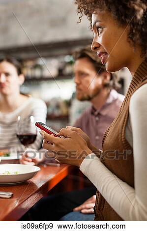 Friends at wine bar View Large Photo Image Stock Photo - Friends at wine bar. Fotosearch