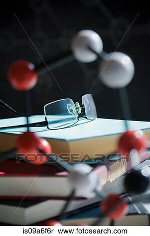 Glasses and book with molecular model View Large Photo Image Stock Photography - Glasses and book with molecular model. Fotosearch