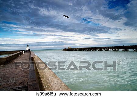 Harbor wall and wooden pier View Large Photo Image Stock Photograph - Harbor wall and wooden pier. Fotosearch