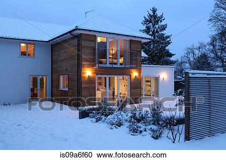 Illuminated family home in snow View Large Photo Image Stock Image - Illuminated family home in snow. Fotosearch