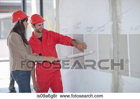 Interior designer and decorator looking at paint swatch View Large Photo Image Stock Photography - Interior designer and decorator looking at paint swatch. Fotosearch