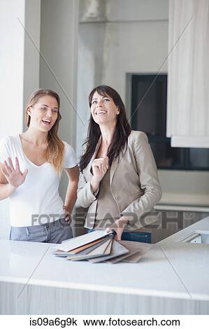 Interior designers discussing swatches in kitchen View Large Photo Image Stock Image - Interior designers discussing swatches in kitchen. Fotosearch