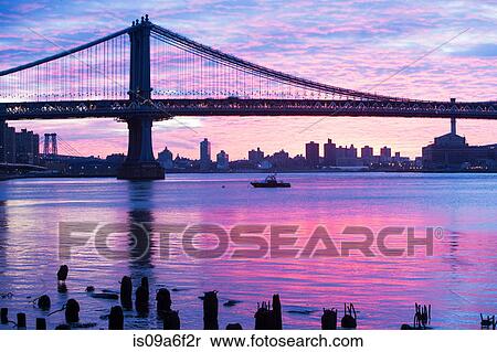 Stock Photography - Manhattan bridge at sunset, New York City, USA. Fotosearch
