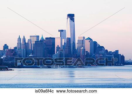 Manhattan skyline and waterfront at sunset, New York City, USA View Large Photo Image Stock Image - Manhattan skyline and waterfront at sunset, New York City, USA. Fotosearch