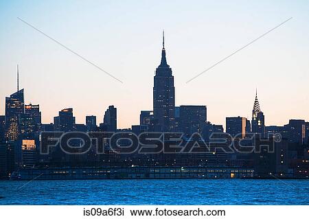 Stock Image - Manhattan skyline at dusk, New York City, USA. Fotosearch