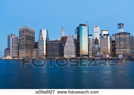 Manhattan skyline at dusk, New York City, USA View Large Photo Image Stock Photo - Manhattan skyline at dusk, New York City, USA. Fotosearch