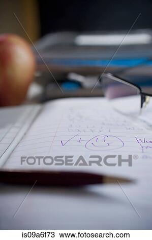 Marked school notebook with smiley face View Large Photo Image Stock Image - Marked school notebook with smiley face. Fotosearch