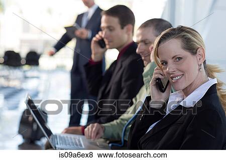 Stock Photo - Mature businesswoman on cell phone. Fotosearch