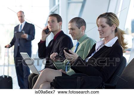 Stock Photo - Mature businesswoman using cell phone. Fotosearch