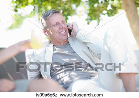 Mature man on cell phone View Large Photo Image Stock Photo - Mature man on cell phone. Fotosearch