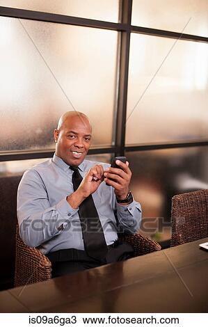 Mature man using cell phone View Large Photo Image Stock Image - Mature man using cell phone. Fotosearch