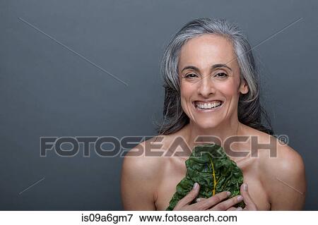 Stock Photo - Mature woman with chard. Fotosearch