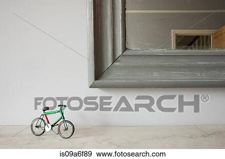 Miniature bicycle by mirror View Large Photo Image Stock Photo - Miniature bicycle by mirror. Fotosearch