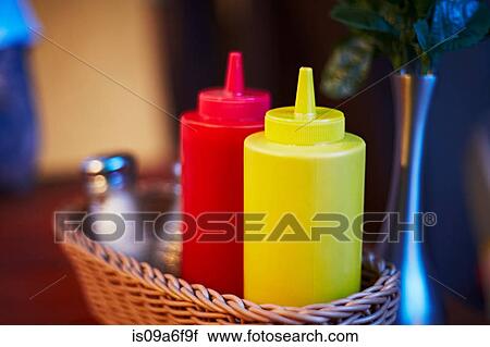 Mustard and ketchup in cafe View Large Photo Image Stock Image - Mustard and ketchup in cafe. Fotosearch
