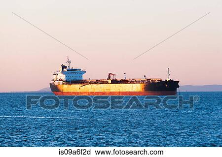 Oil tanker at sunset View Large Photo Image Stock Image - Oil tanker at sunset. Fotosearch