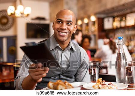 Stock Photo - Paying the bill. Fotosearch