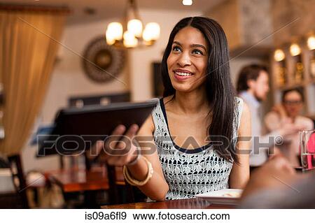 Stock Photo - Paying the bill. Fotosearch