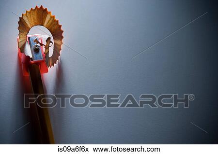 Stock Photo - Pencil being sharpened with pencil sharpener. Fotosearch