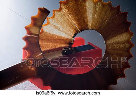 Stock Photo - Pencil being sharpened with pencil sharpener. Fotosearch