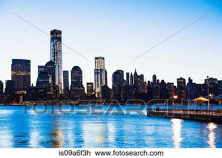 Pier and Manhattan skyline at dusk, New York City, USA View Large Photo Image Stock Image - Pier and Manhattan skyline at dusk, New York City, USA. Fotosearch