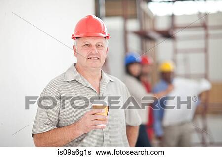 Portrait of a builder having a coffee break View Large Photo Image Stock Photograph - Portrait of a builder having a coffee break. Fotosearch